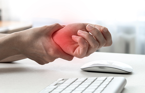 Patient suffering from carpal tunnel syndrome due to typing