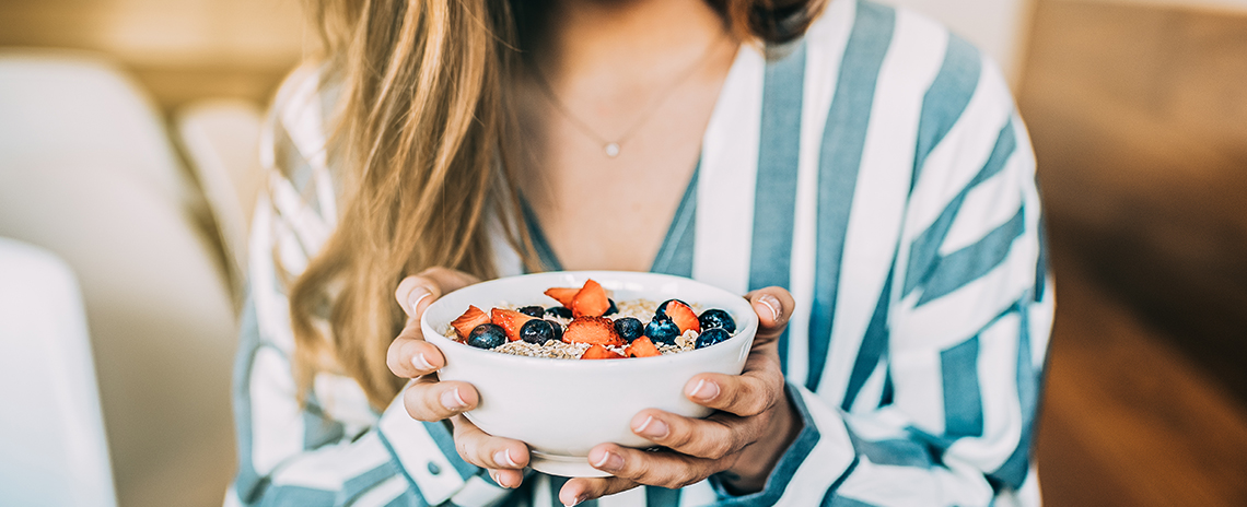 Woman choosing to eat a healthier breakfast in the mornin