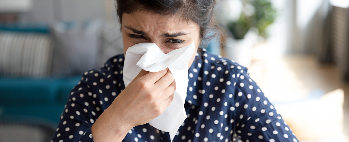Woman suffering with severe allergies