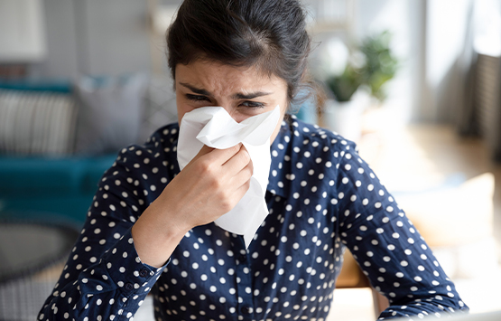 Woman in need of allergy relief through chiropractic care