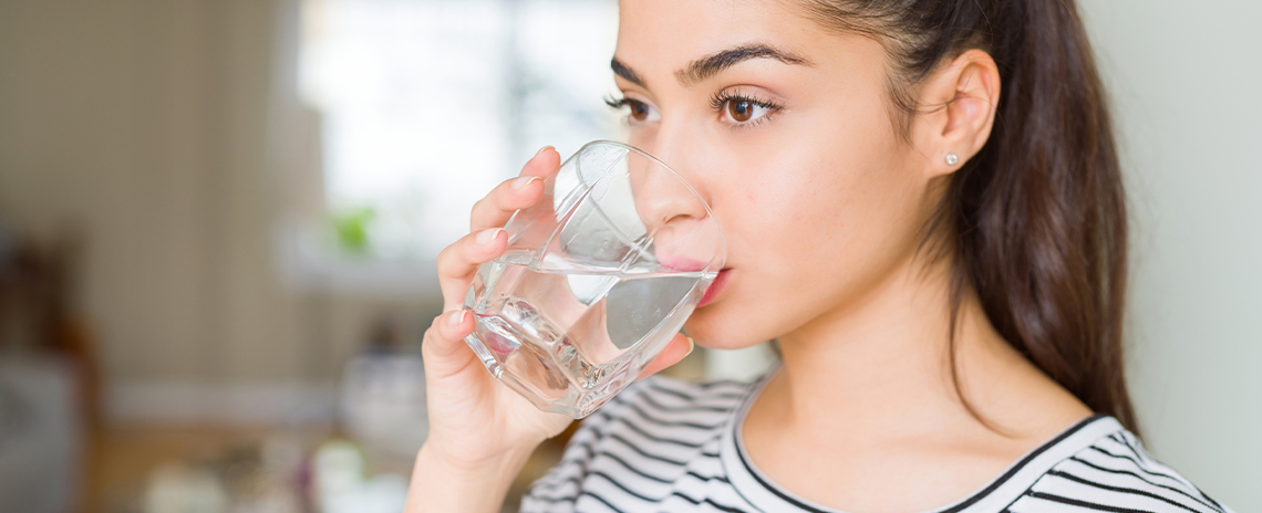Healthy girl drinking a nice glass of water