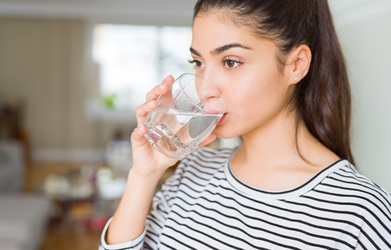 Healthy girl drinking a nice glass of water