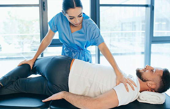 Male patient receiving chiropractic treatment for sciatica at Neck, Back, Arm, Leg and Headache Pain Relief Clinic of Marin in San Rafael