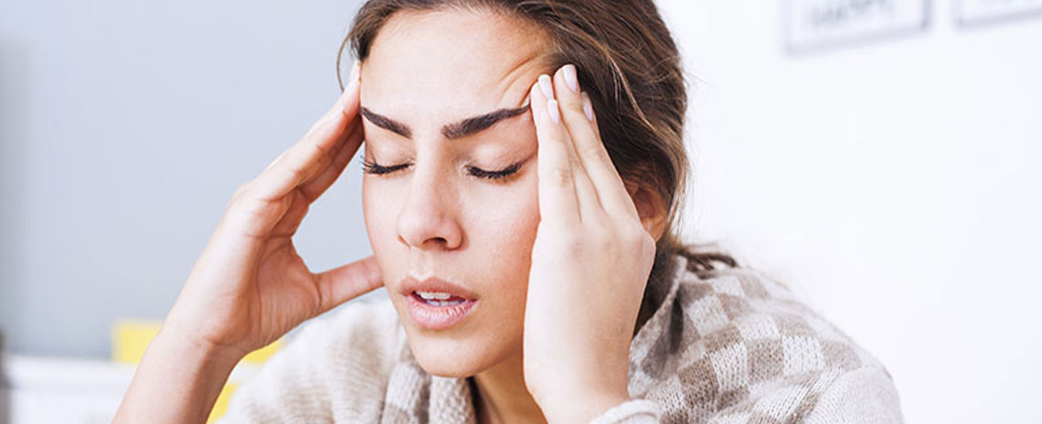 Woman suffering with headache