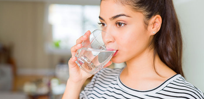 patient drinking water to be healthy under the guidance of San Rafael chiropractor