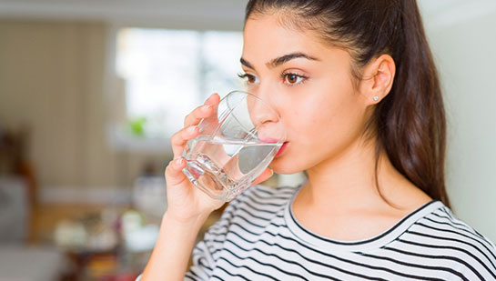 patient drinking water to be healthy under the guidance of San Rafael chiropractor