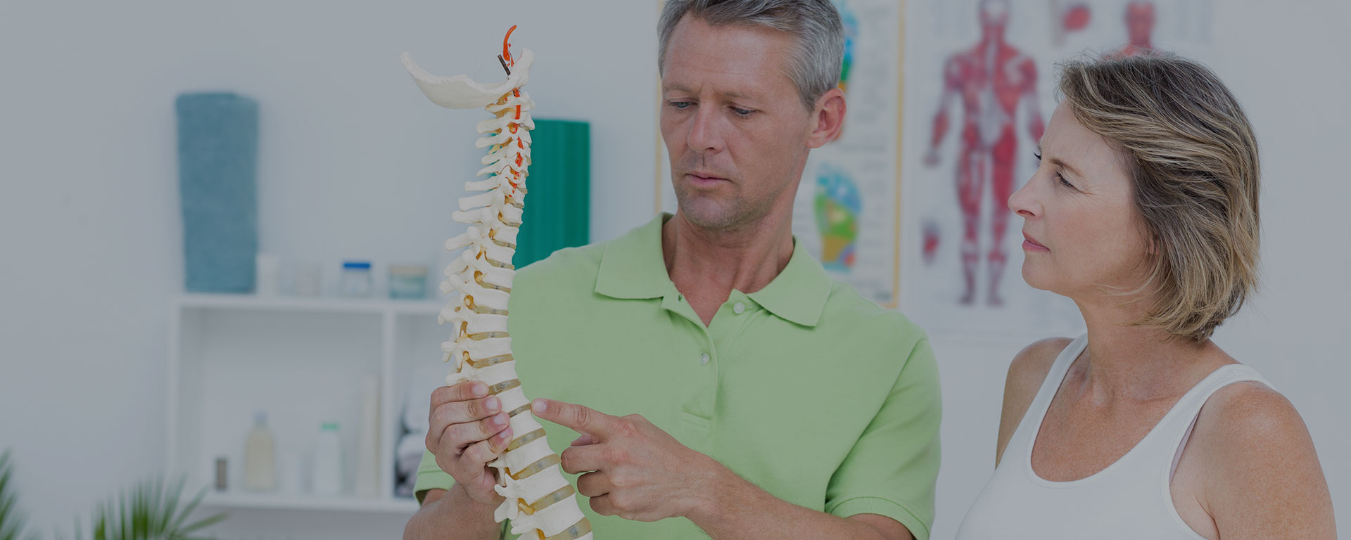 San Rafael Chiropractor explaining alignment issue to female patient