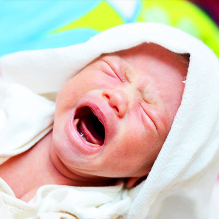 Baby crying because of colic in need of chiropractic care in San Rafael
