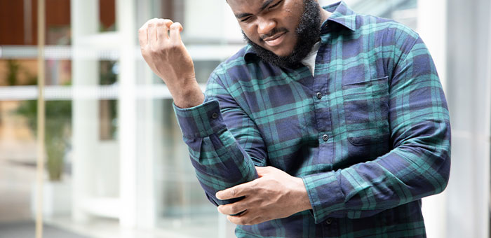 patient needing elbow pain treatment in San Rafael