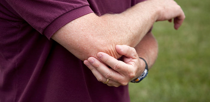 patient needing golfer's elbow treatment in San Rafael