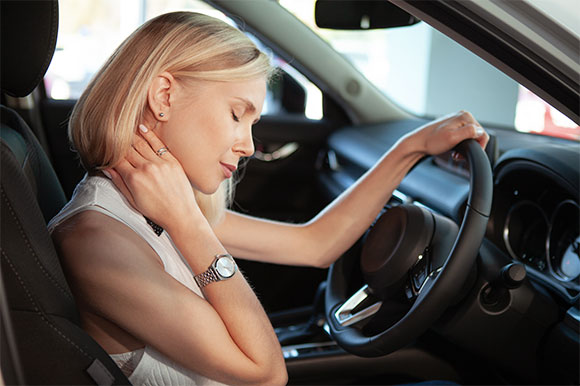 Woman in need of auto accident injury care at Neck, Back, Arm, Leg and Headache Pain Relief Clinic of Marin in San Rafael after an auto accident resulting in whiplash