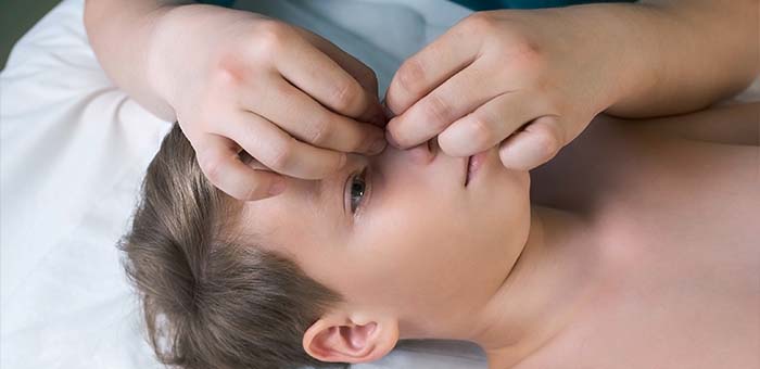 patient receiving cranial sacral technique in San Rafael